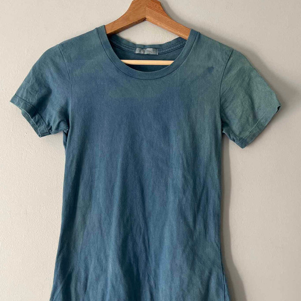 
                  
                    Flat indigo tshirt on a hanger
                  
                
