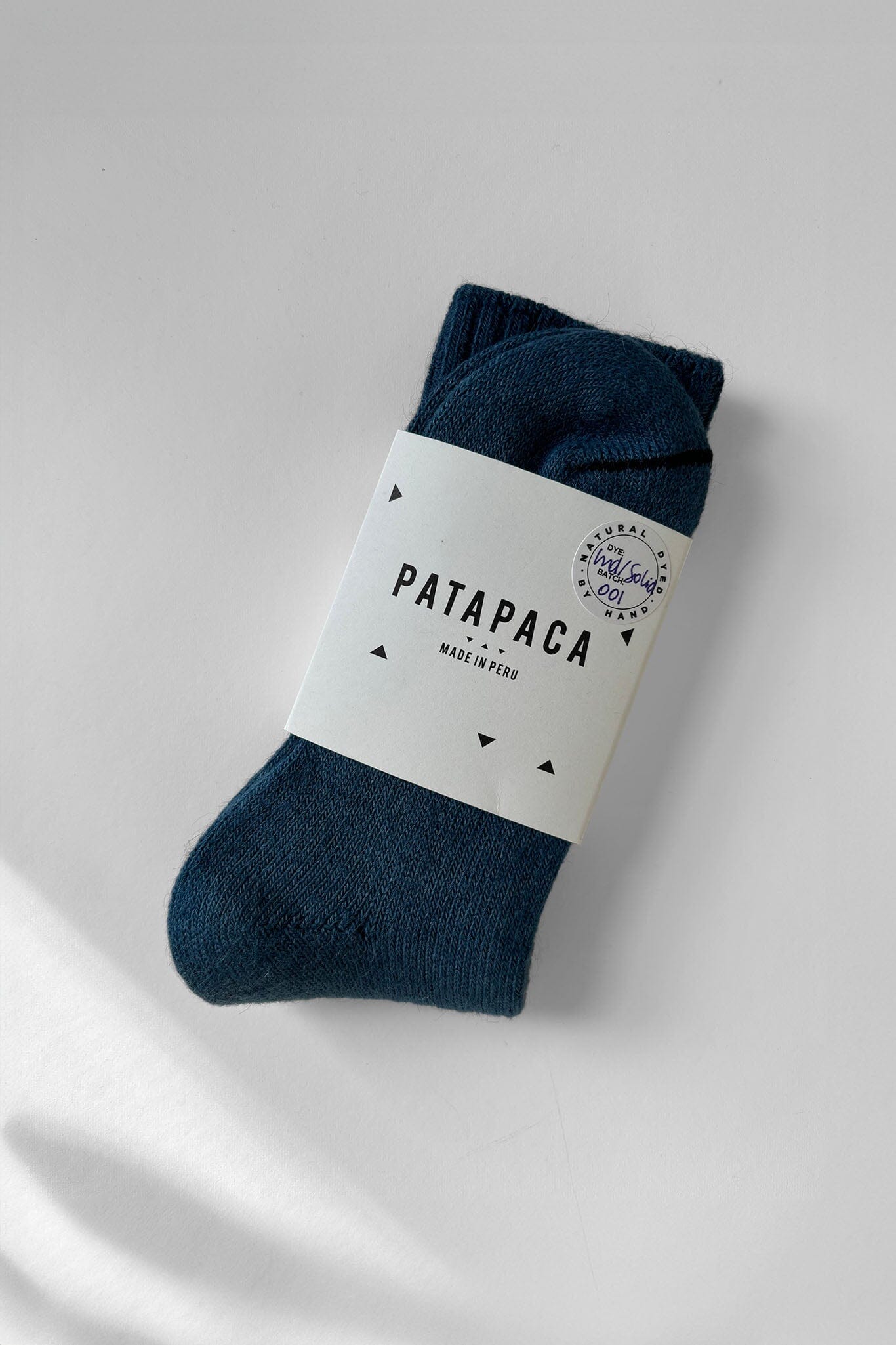 Indigo alpaca socks in Pata Paca packaging