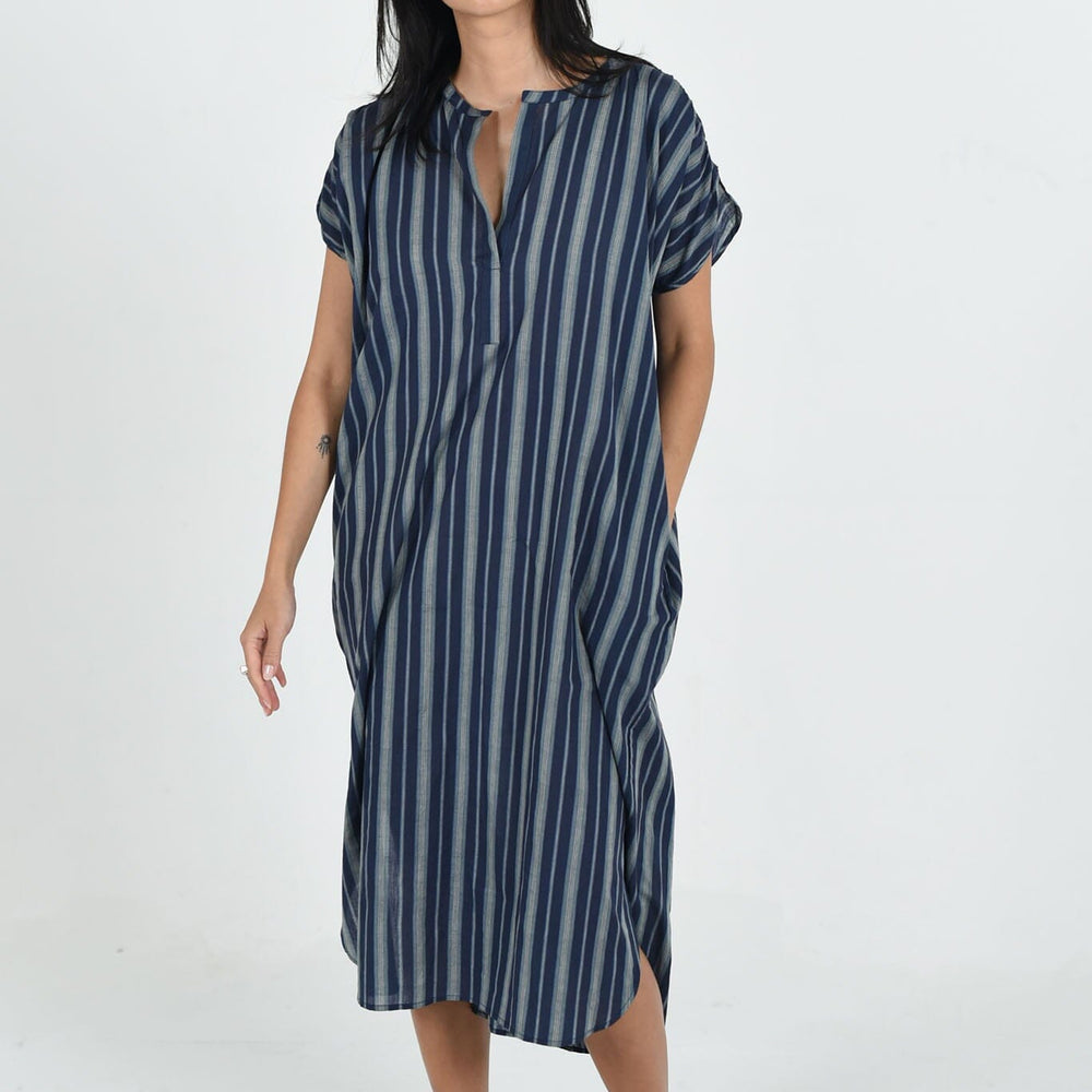 Navy Stripe Sydney dress by M.Patmos in size large, crafted from a sustainable cotton-silk blend with a flowing, minimalist fit and handy side pockets for versatile wear.
