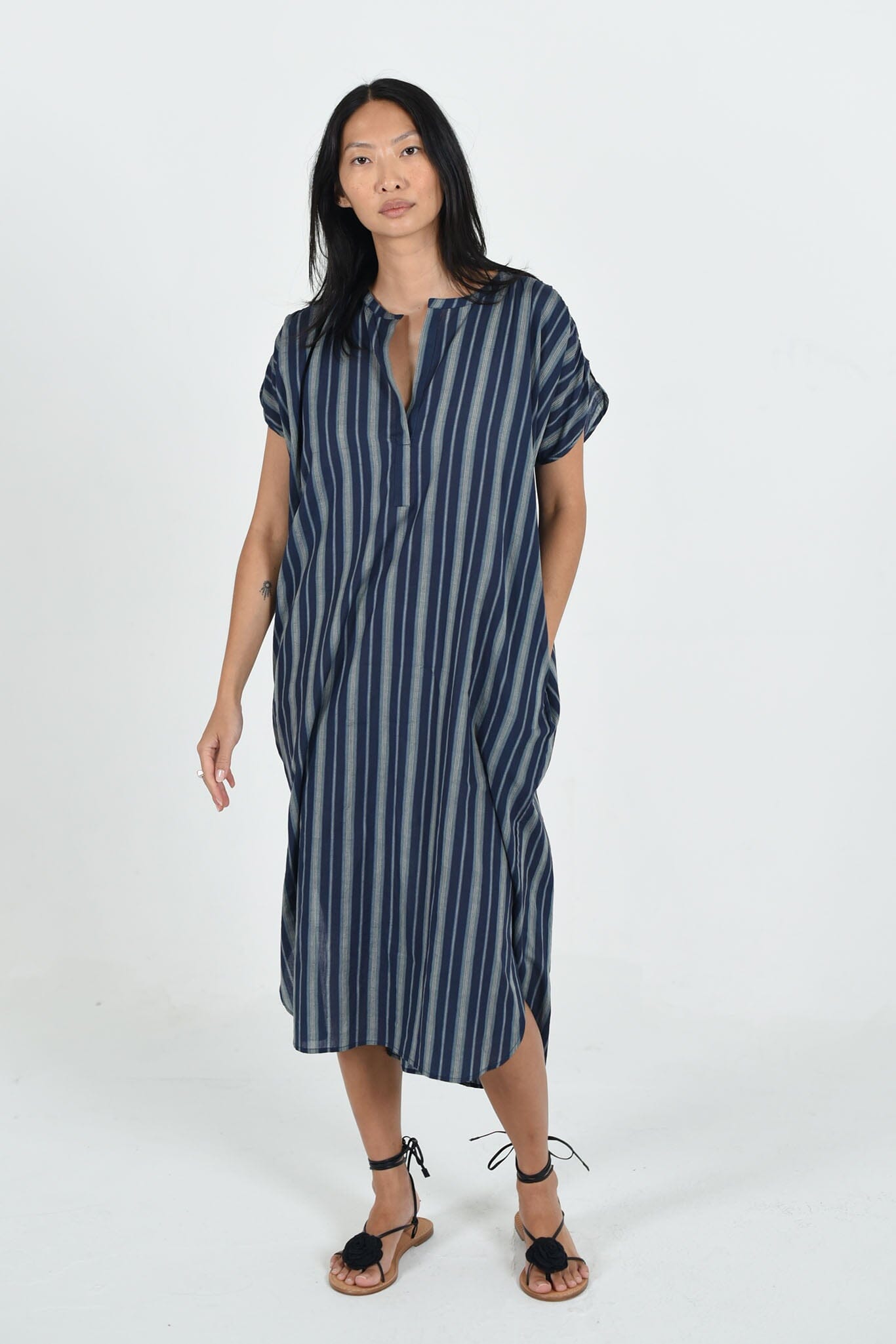 Navy Stripe Sydney dress by M.Patmos in size large, crafted from a sustainable cotton-silk blend with a flowing, minimalist fit and handy side pockets for versatile wear.
