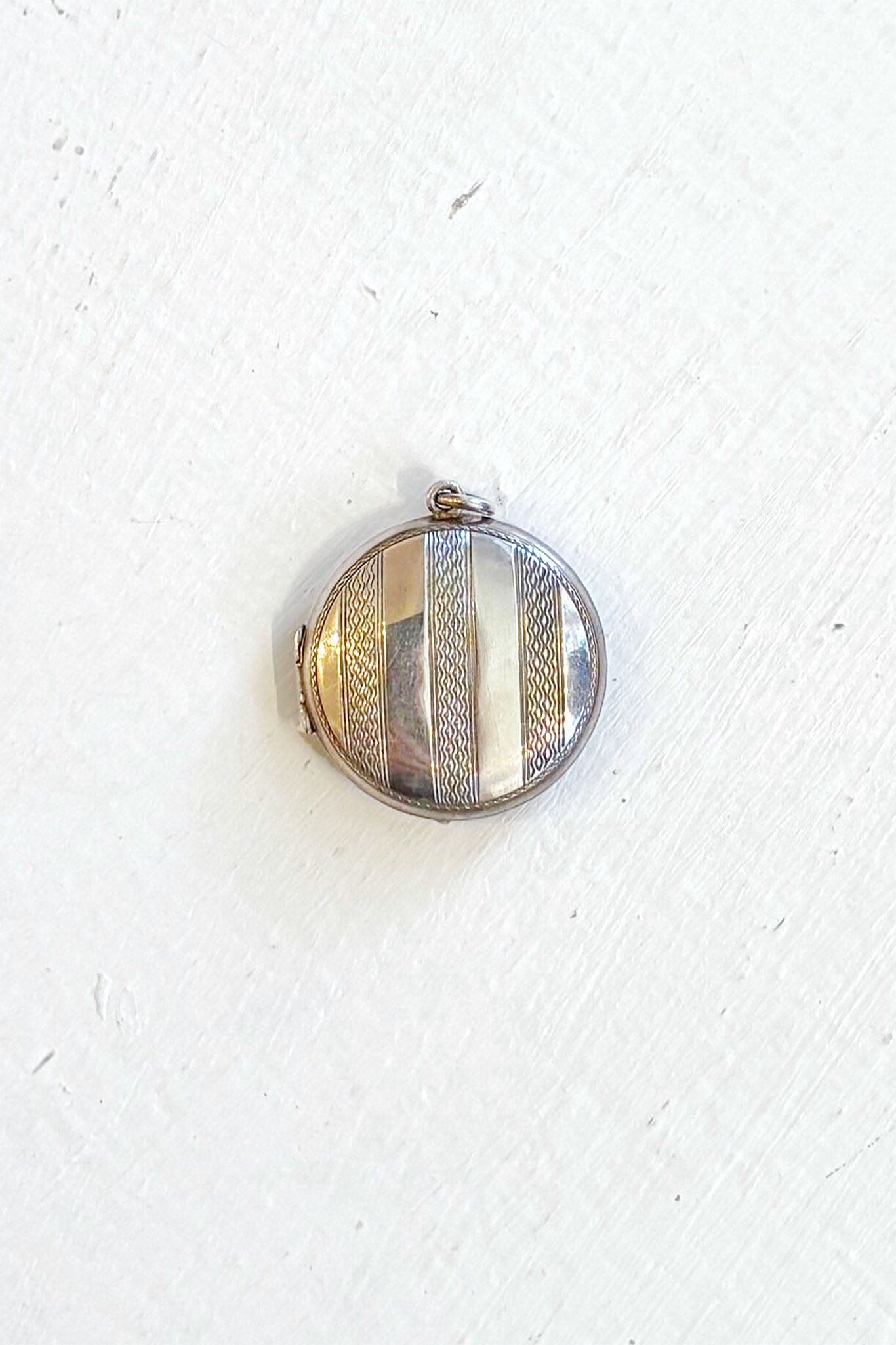 Round silver vintage locket on a white background