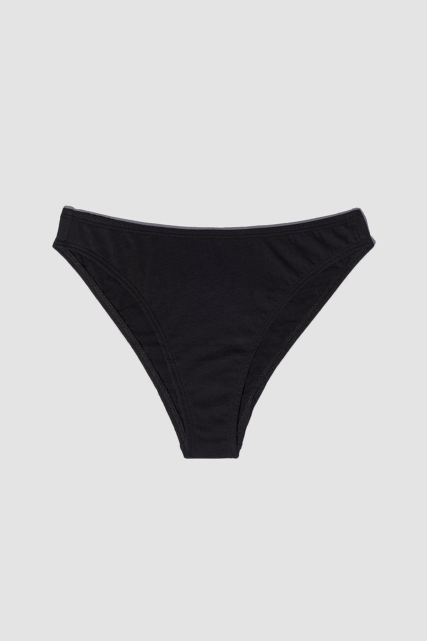 This image features the Oddobody Mid Rise French Cut panty in black, highlighting its sleek and elegant design. The panty is crafted with a comfortable mid-rise waist and a high-cut silhouette that emphasizes a flattering, nostalgic flair reminiscent of 1980s cotton underwear styles.