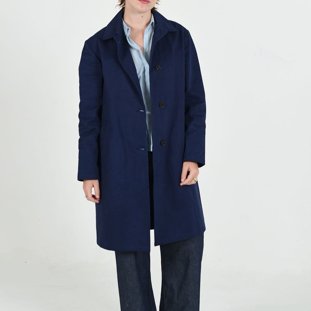 Sylvie Mackintosh trench jacket by M.Patmos in navy, size large, crafted from 100% organic cotton with a classic trench design, functional pockets, and a relaxed fit.