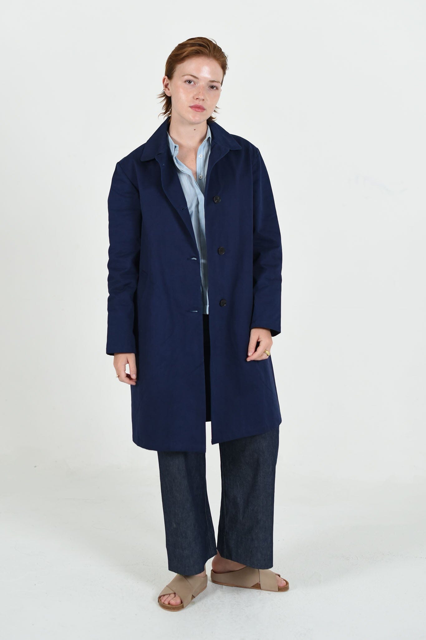 Sylvie Mackintosh trench jacket by M.Patmos in navy, size large, crafted from 100% organic cotton with a classic trench design, functional pockets, and a relaxed fit.