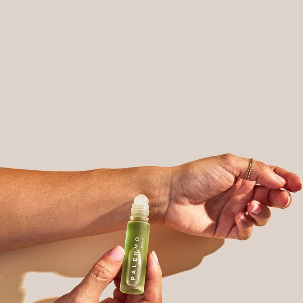 
                  
                    A person applying a bottle of Palermo aromatherapy oil
                  
                