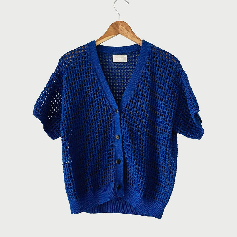 The medium Knoll Cardigan in Cobalt by M.Patmos is made from 100% Peru-grown cotton with a v-neckline, natural horn buttons, knit by Fair Trade certified artisans.