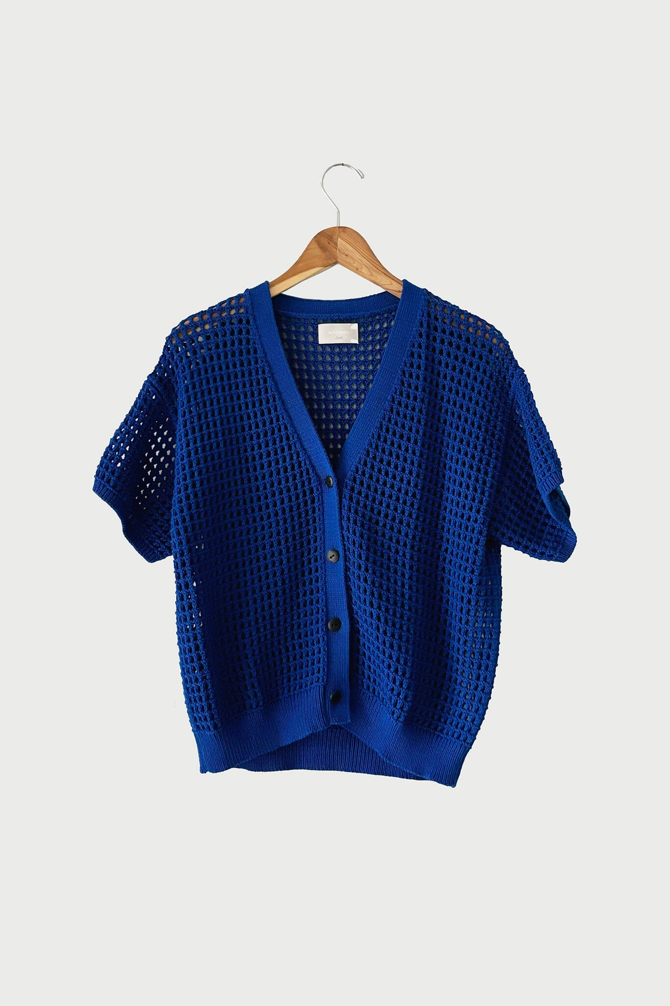 The medium Knoll Cardigan in Cobalt by M.Patmos is made from 100% Peru-grown cotton with a v-neckline, natural horn buttons, knit by Fair Trade certified artisans.