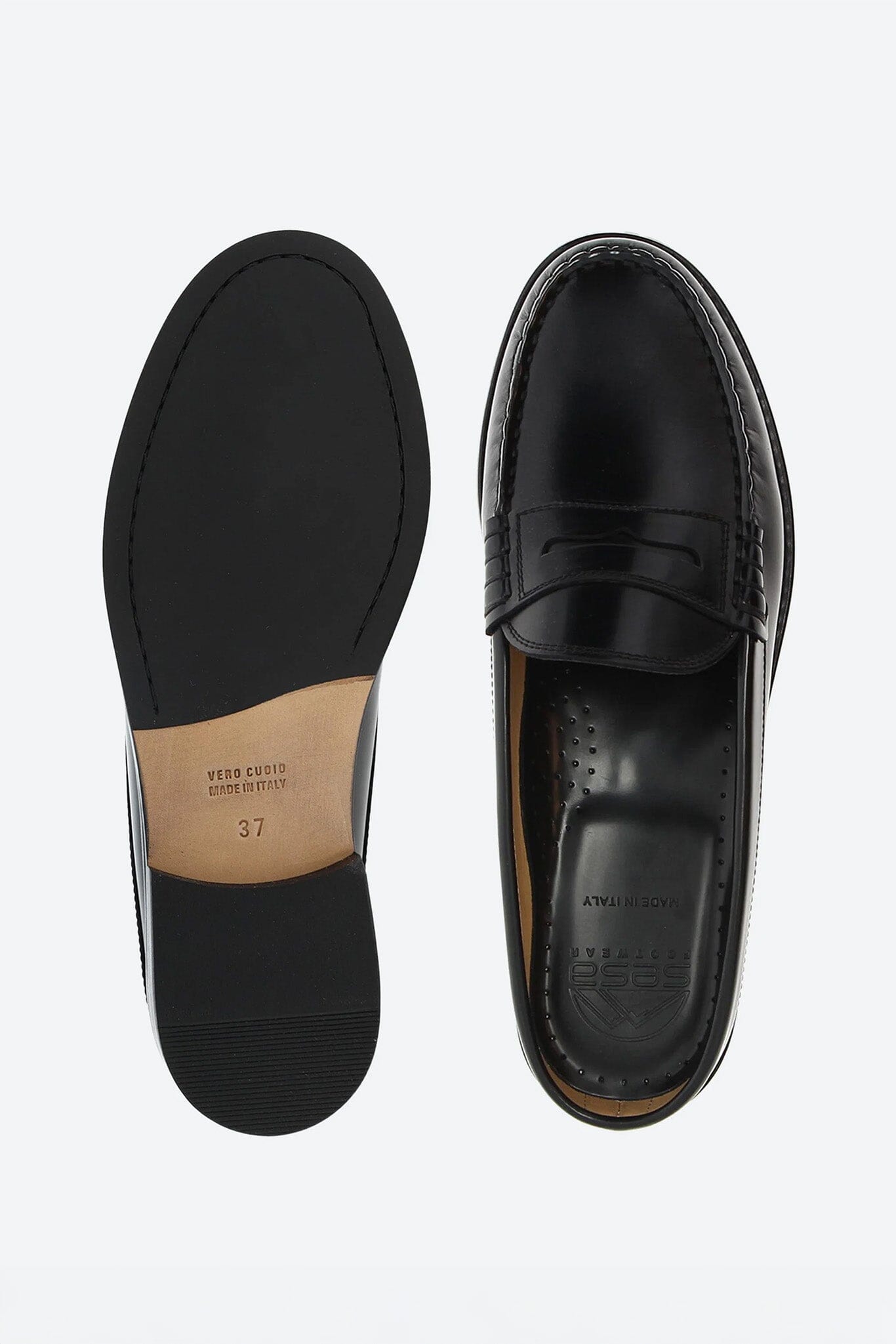 Black leather loafer shoes on a white background