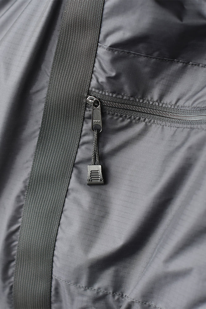 
                  
                    A close up of the 8.6.4. nylon zipper tote
                  
                