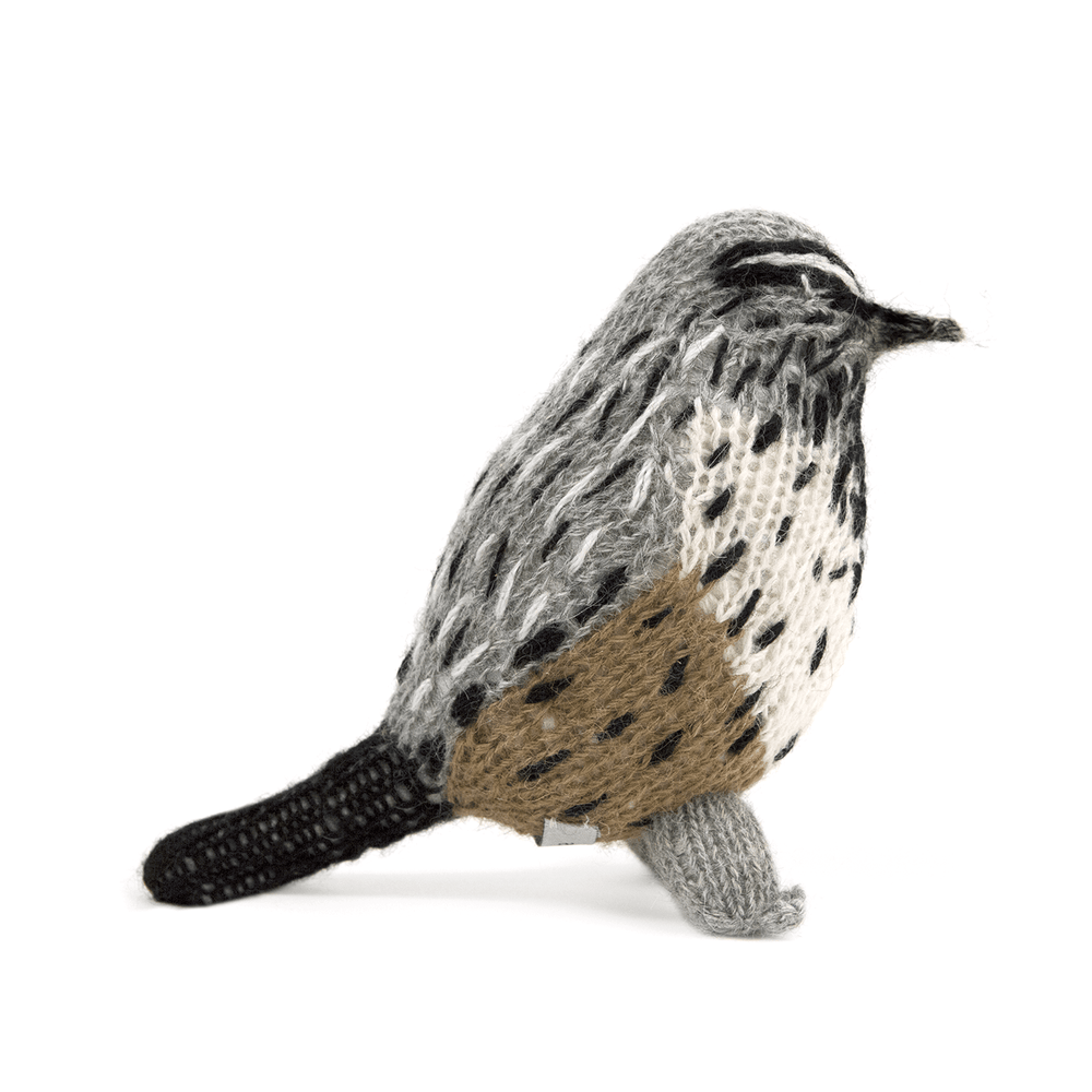 Hand-knit wool bird toy with gray and brown stripes, resembling a cactus wren.