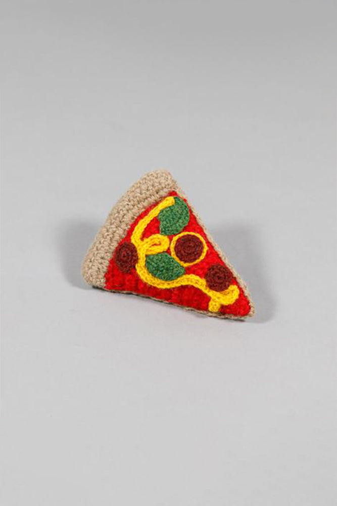 A felted pizza dog toy on a grey background.