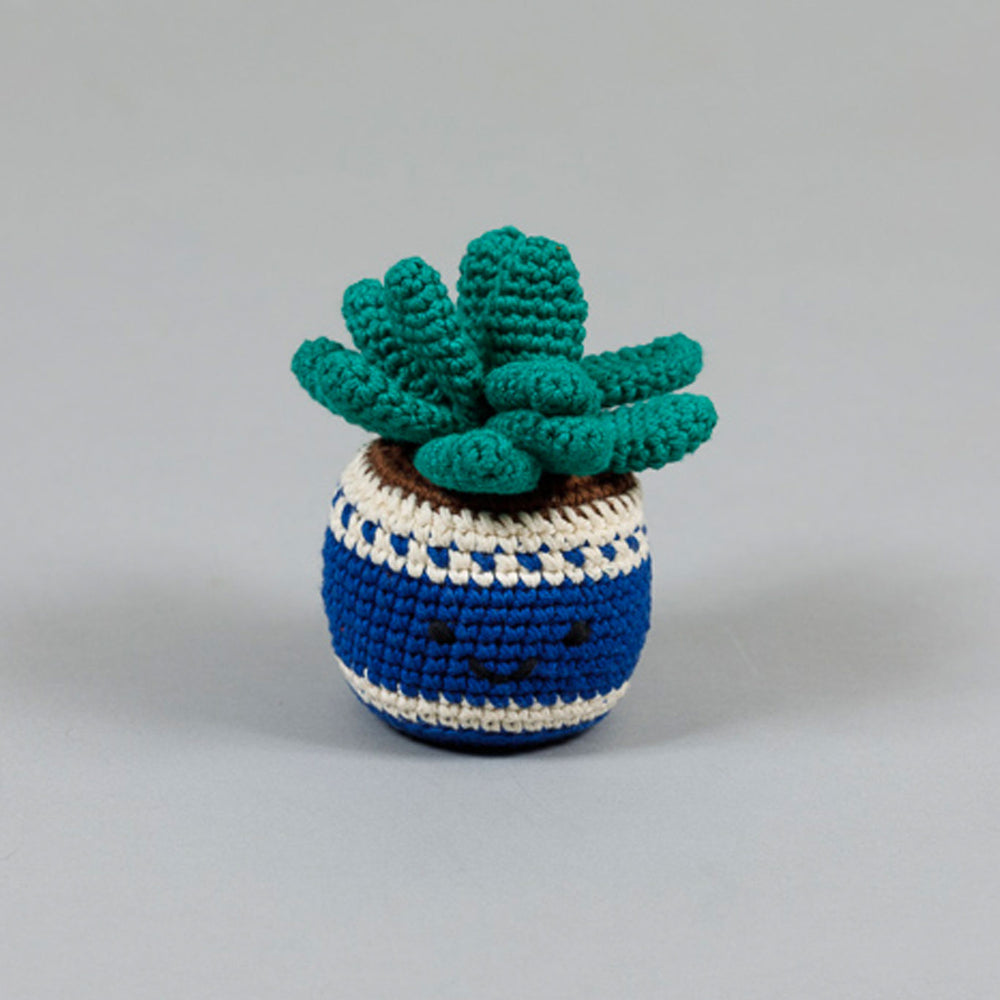 A crochet potted cactus dog toy with green leaves and a blue and white striped pot.