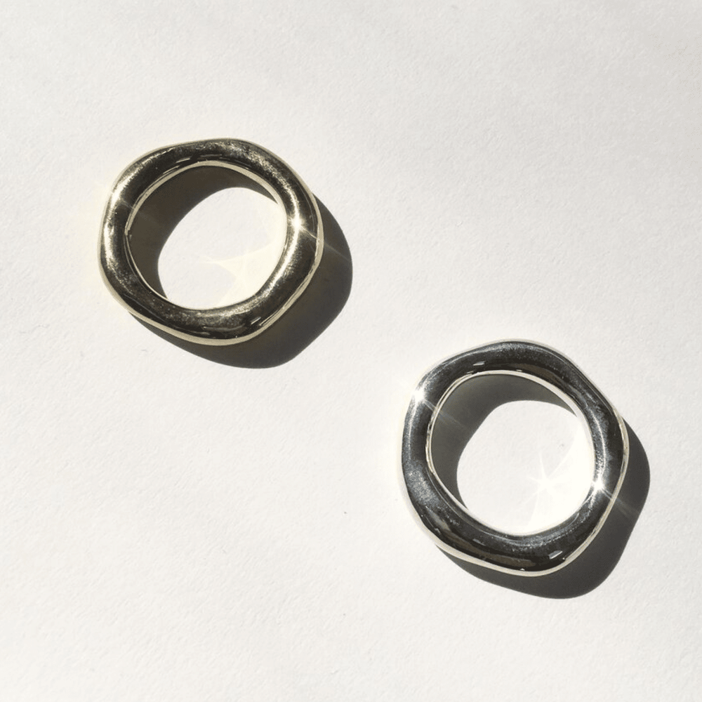 
                  
                    Two sterling silver organic bands on a white background
                  
                