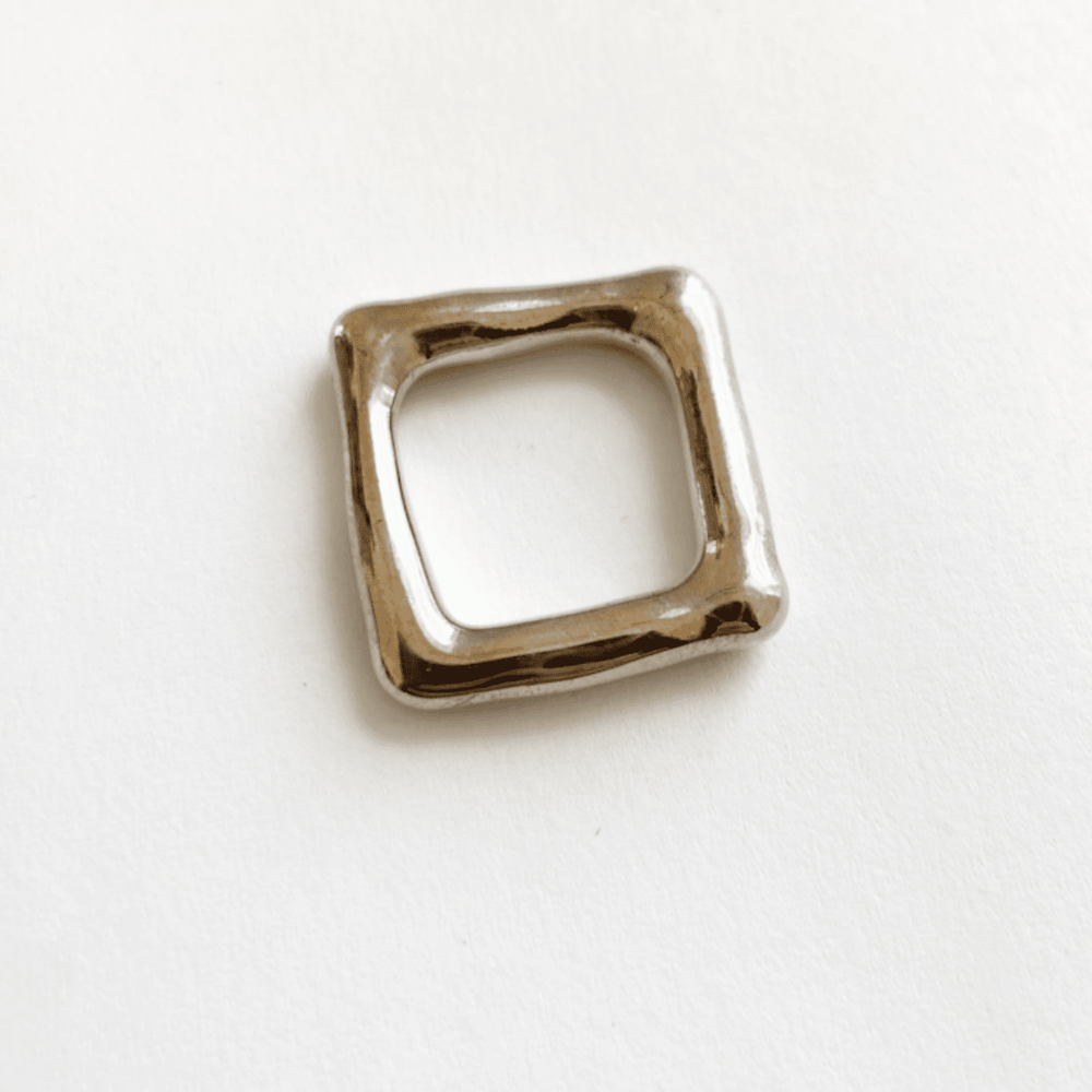 The top view of a solid heavy silver square band ring