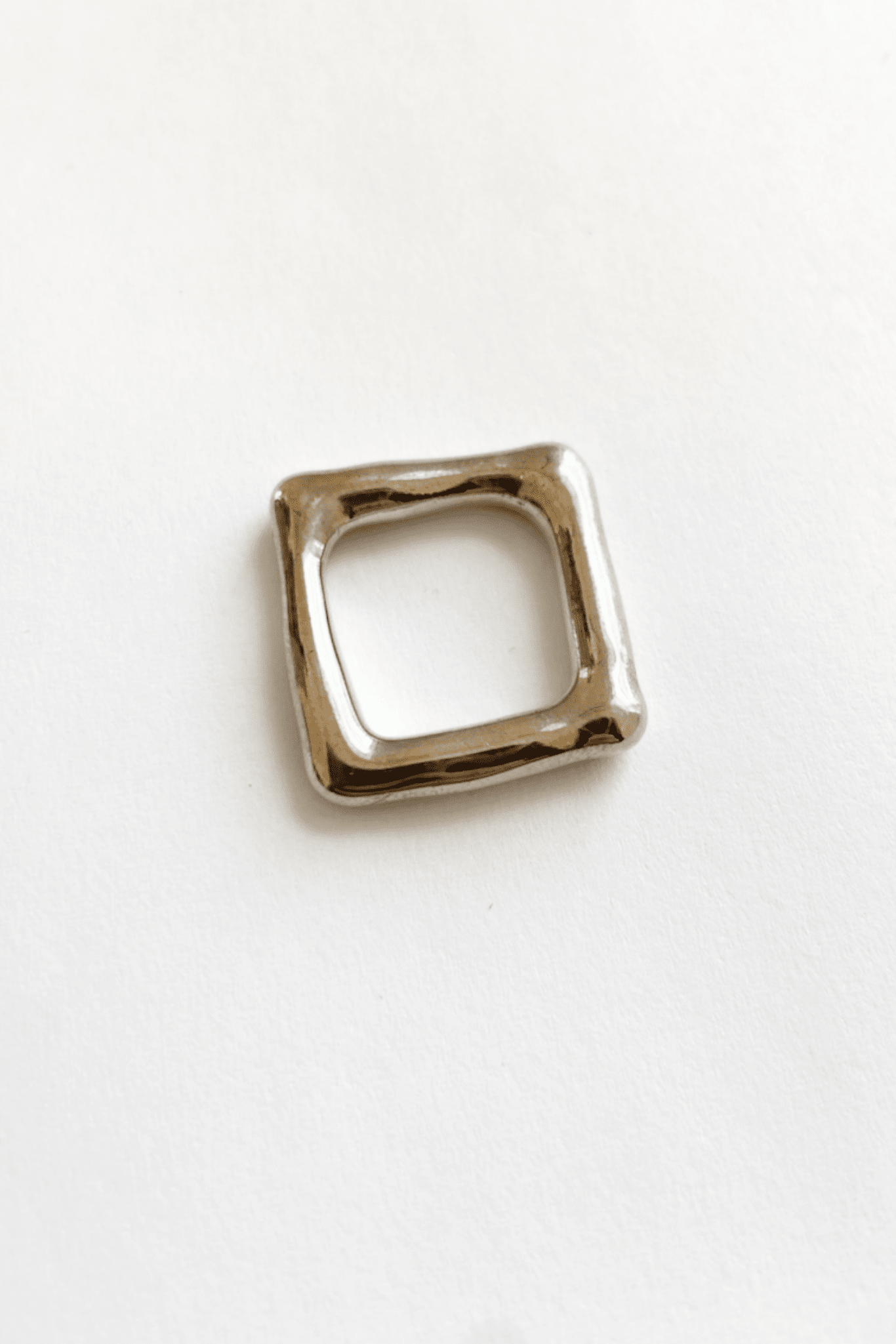 The top view of a solid heavy silver square band ring
