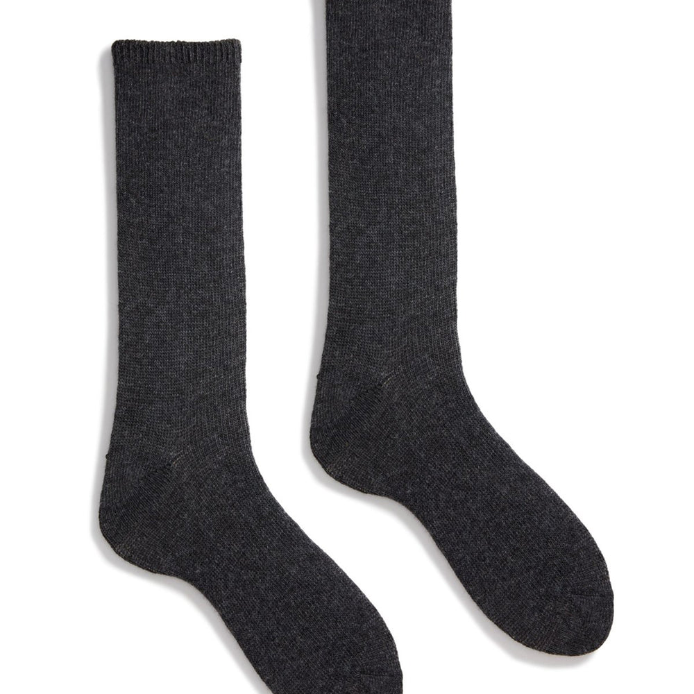 A pair of charcoal-colored cashmere ad wool socks laid out flat.