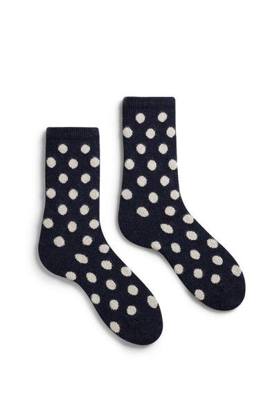 Dark navy cashmere crew socks with white polka dots.