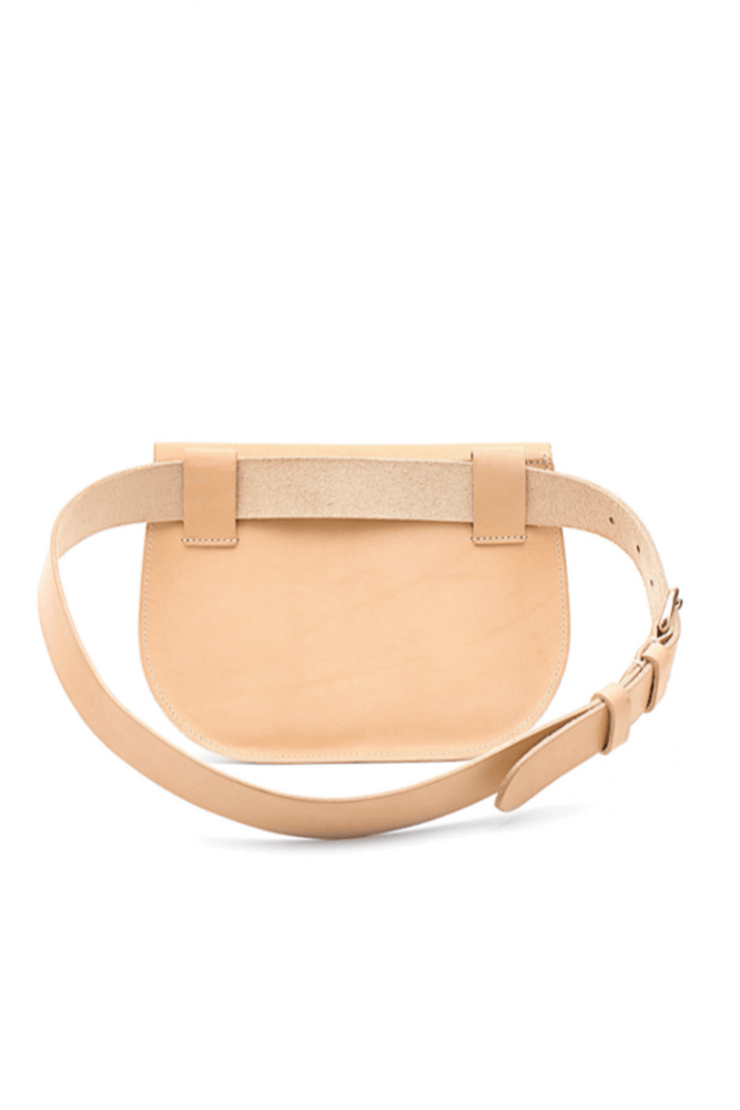 
                  
                    The back of a beige Il Bisonte belt pack made of cowhide leather, featuring an adjustable belt with a brass buckle.
                  
                
