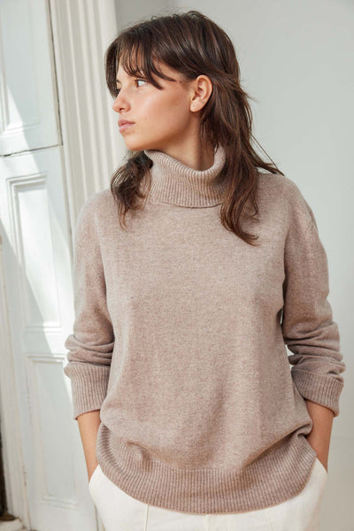 A timeless 100% mongolian cashmere turtleneck sweater. Sophtisicated.