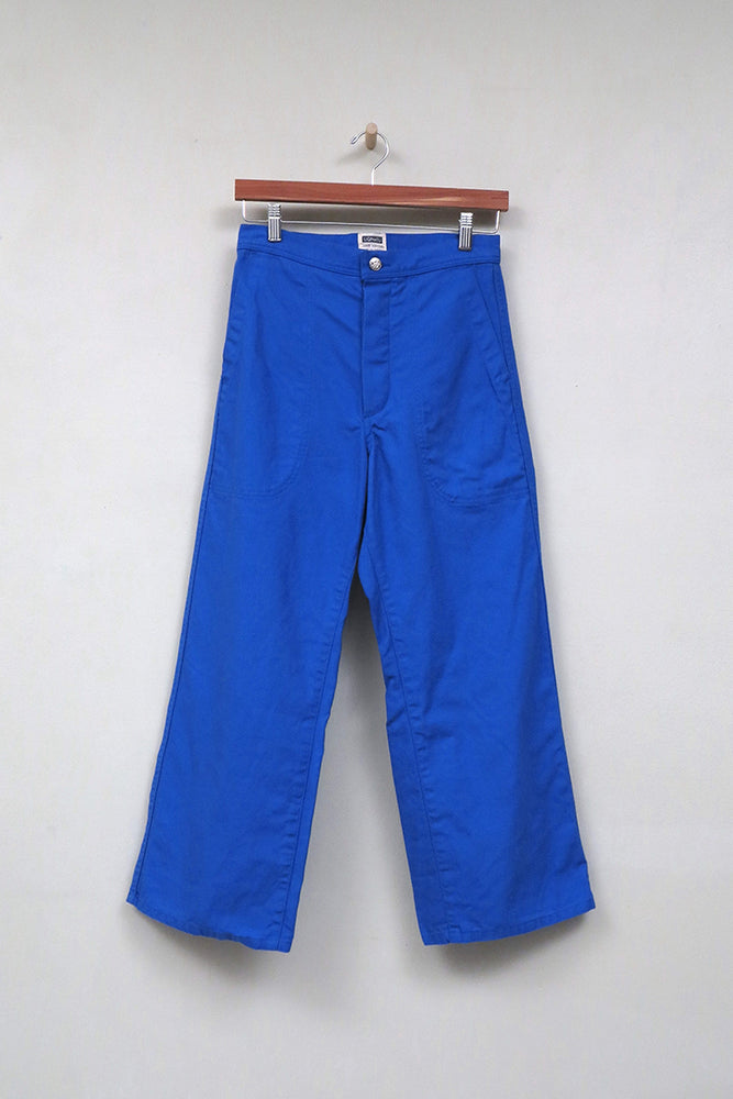 
                  
                    A flat shot of UQNATU cobalt blue high-rise wide-leg crop sailor pants
                  
                