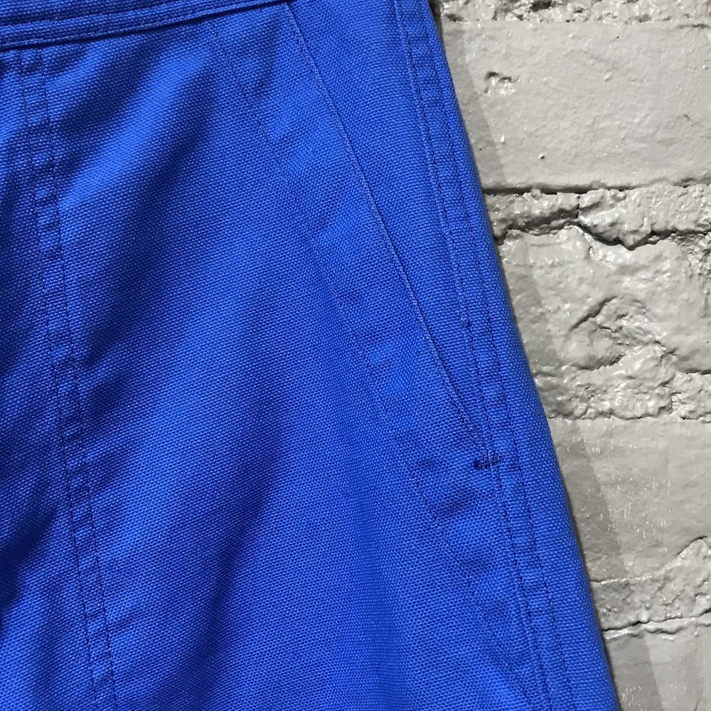 
                  
                    The pocket detail of the UQNATU cobalt blue high-rise wide-leg crop sailor pants
                  
                