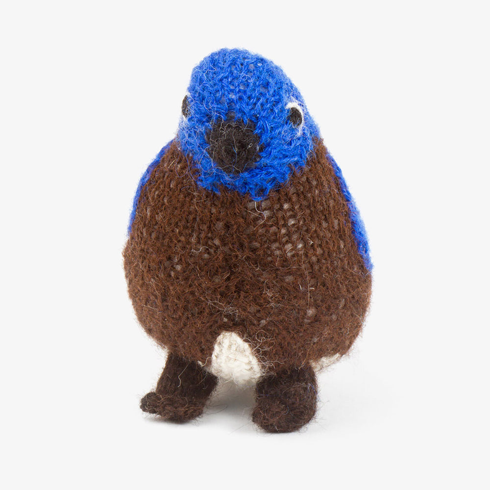 Hand-knit alpaca Eastern Bluebird plush toy with blue head and brown body.